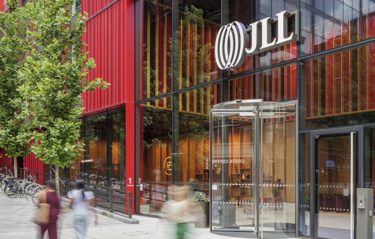 1 Broadgate building exterior in London with colorful facade, JLL signage and traffic-free pedestrian plaza