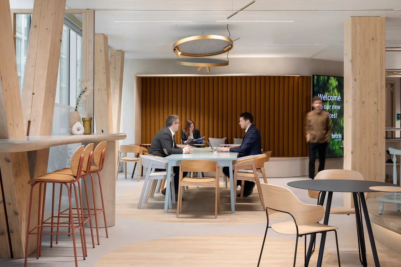 JLL colleagues in meeting room in modern  office space, furniture and greeneryJLL colleagues in meeting room in modern  office space, furniture and greenery