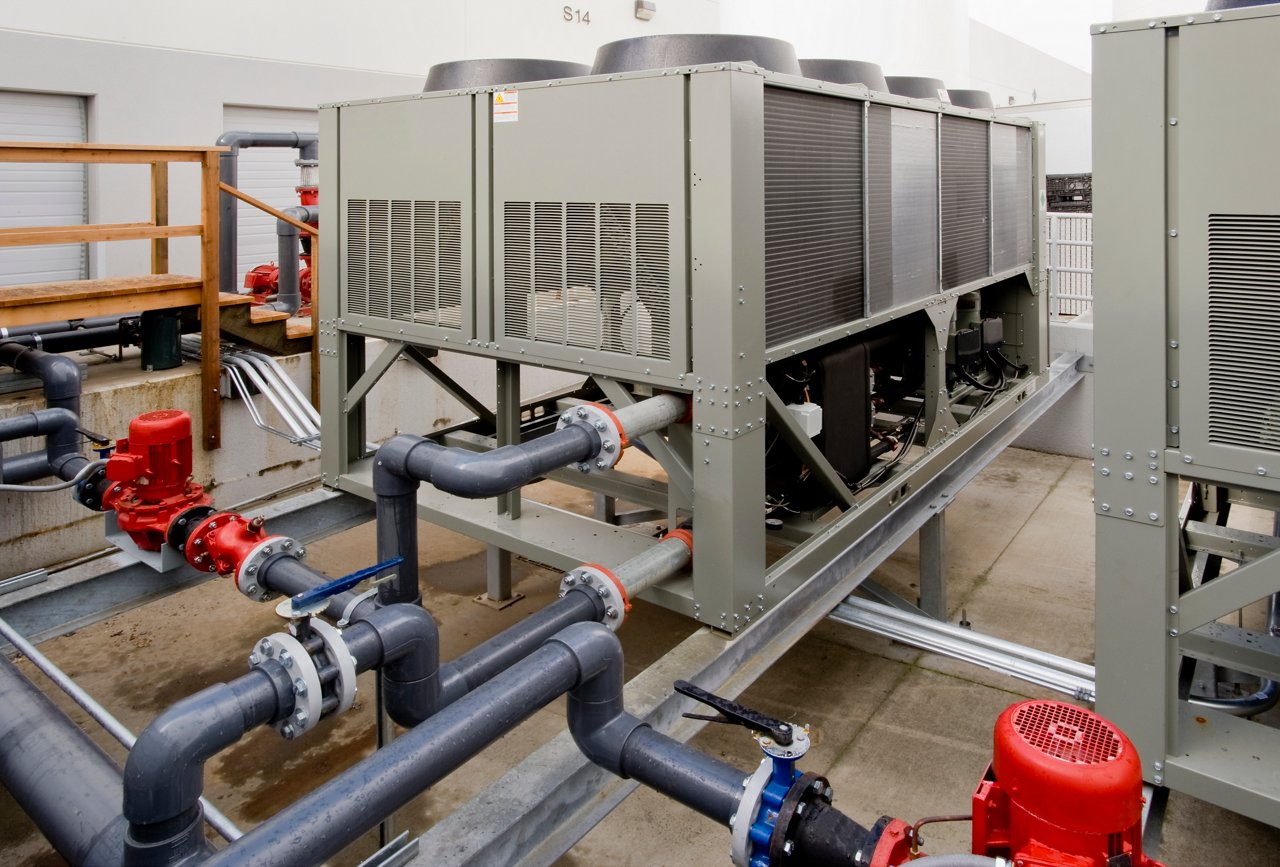 Large industrial HVAC chiller unit with air-cooled condensers
