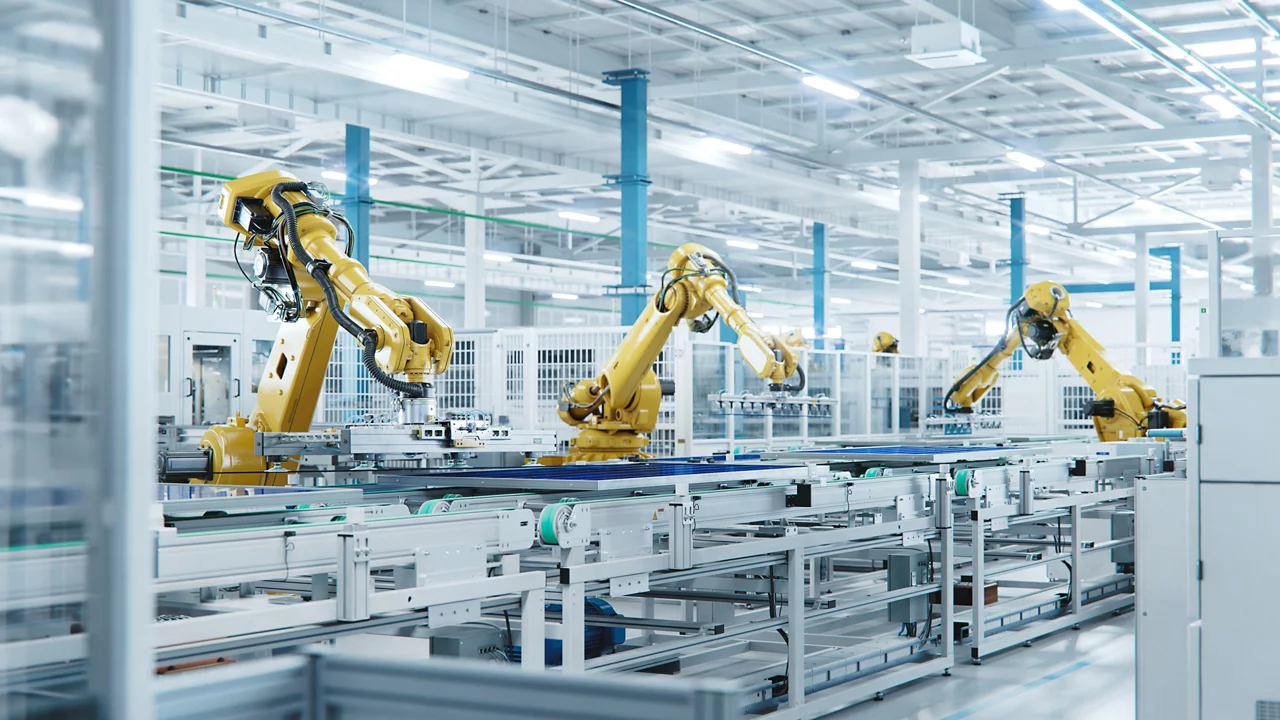 Large Production Line with Industrial Robot Arms at Modern Bright Factory.