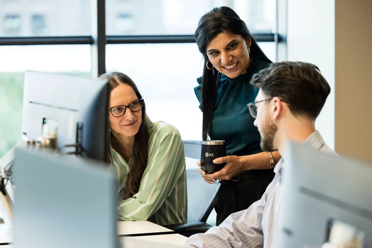 JLL advisors collaborating on property valuation in Australia.