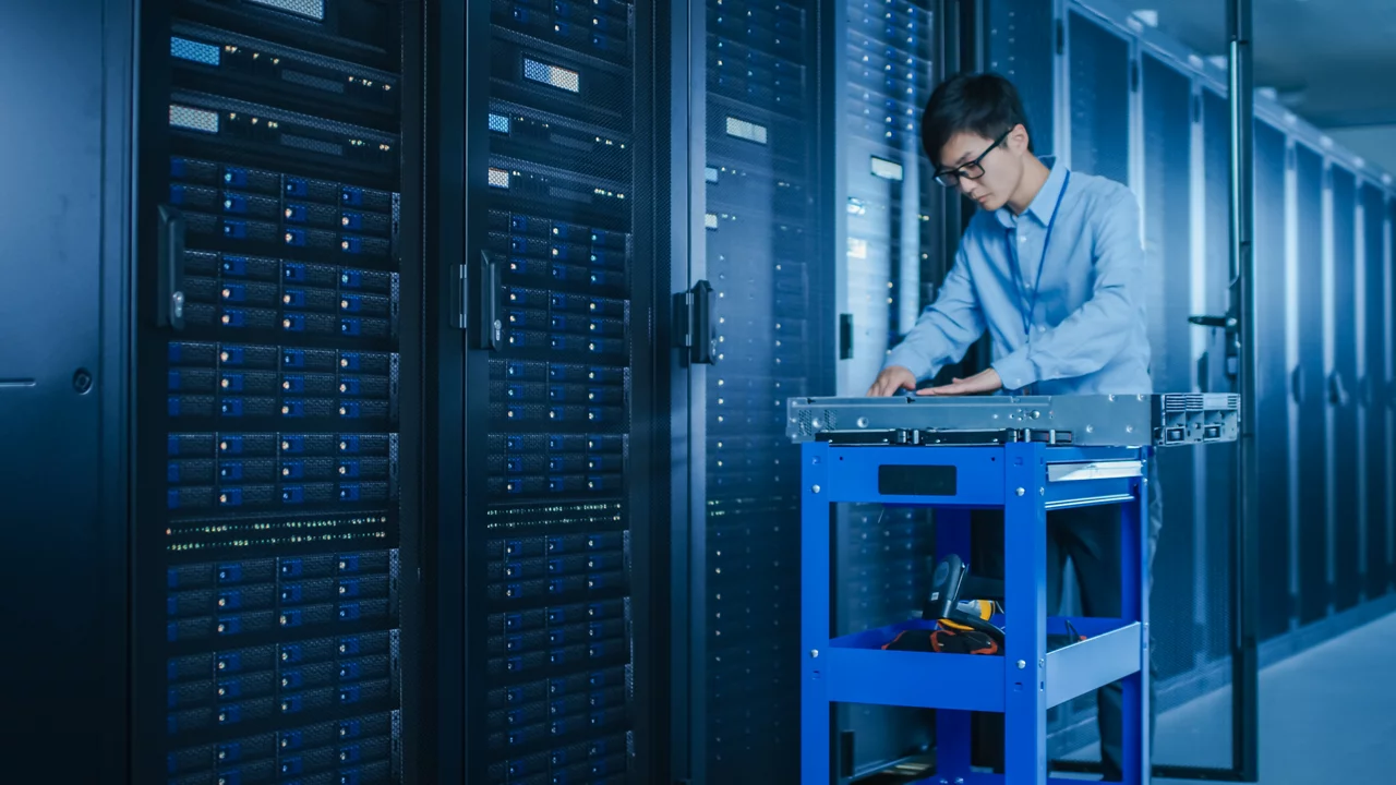 IT technician working in modern data centre