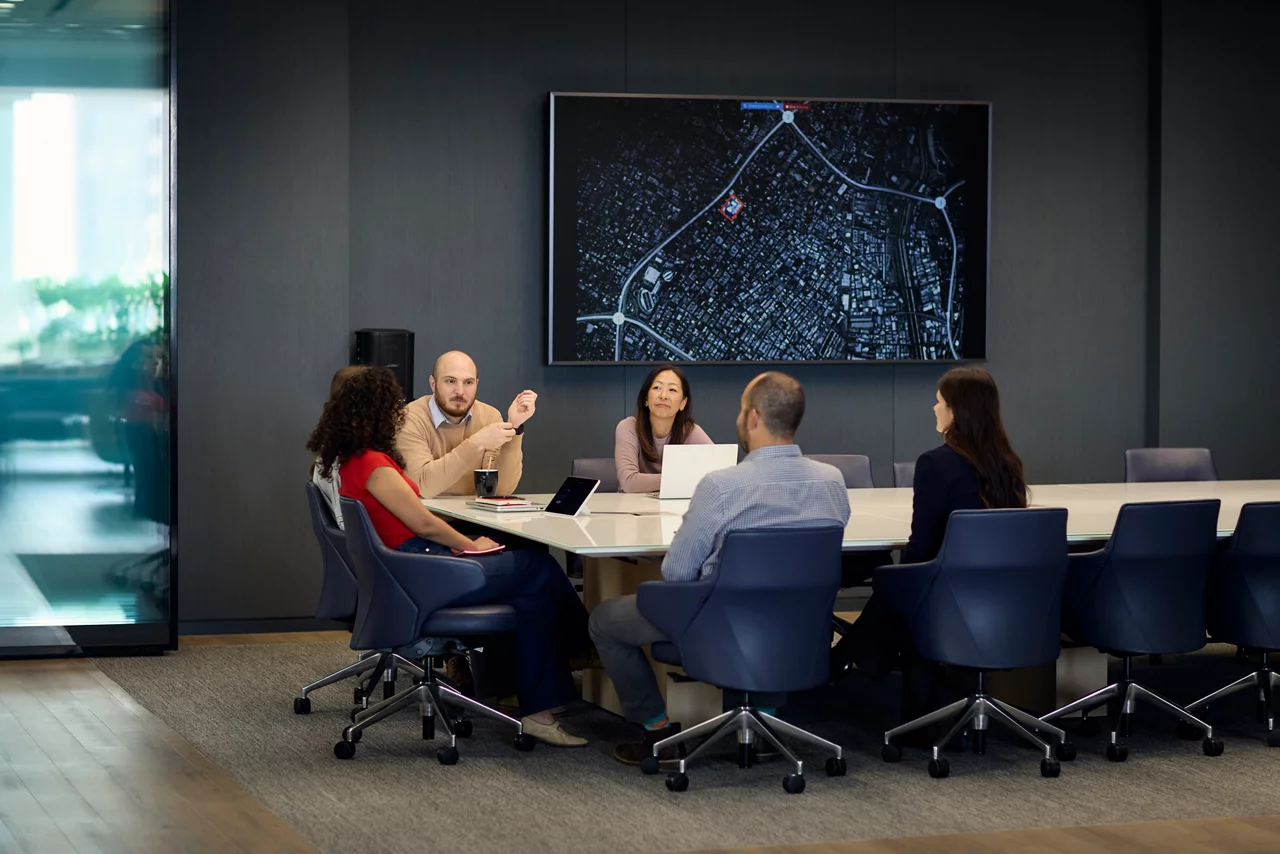 JLL employee in a conference room with their colleagues