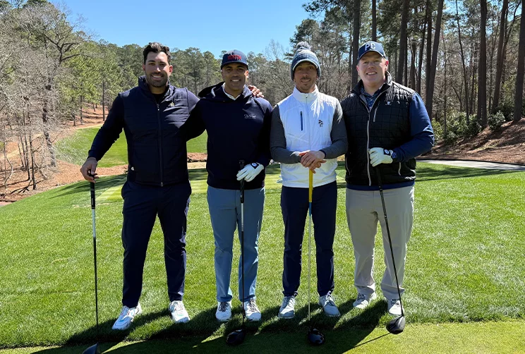 Chris Drew networking with clients and colleagues over a friendly golf game.