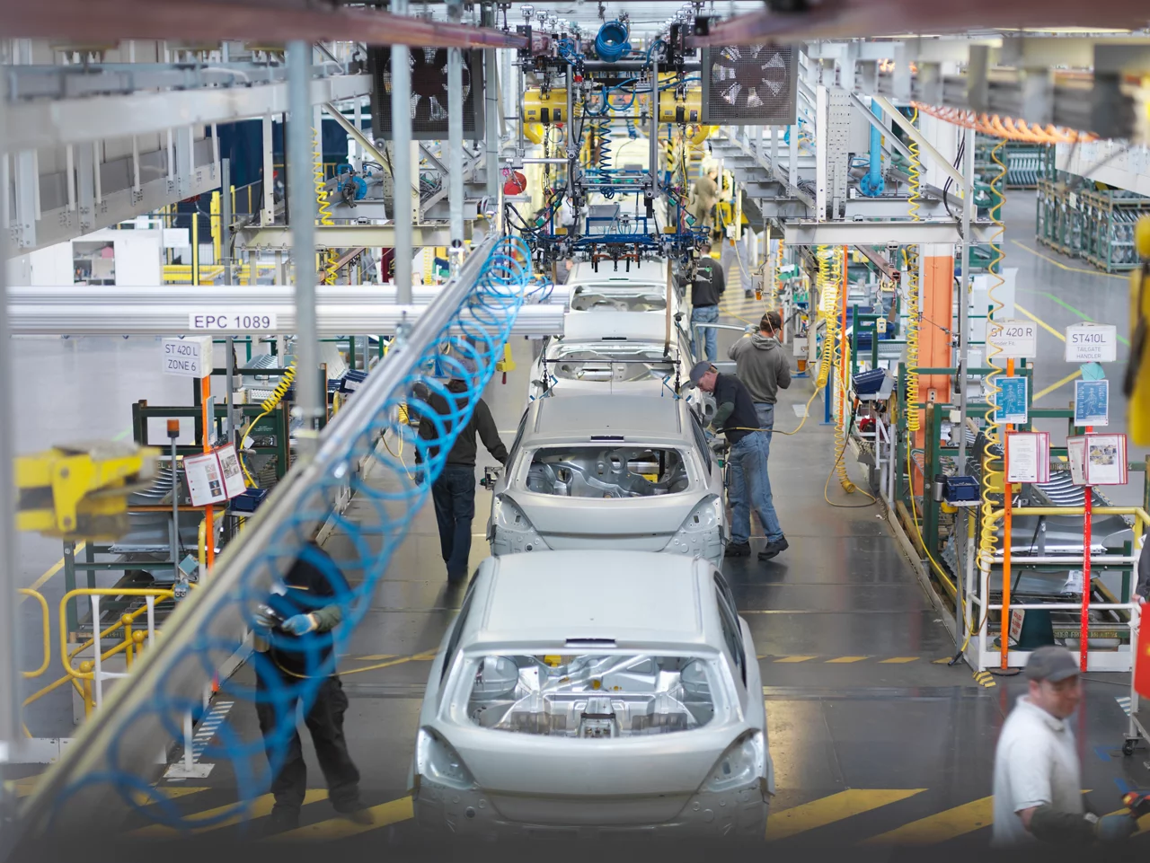 People work at an auto factory