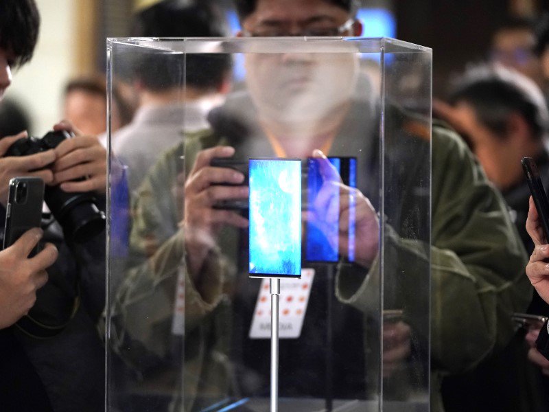 people taking picture of newly launched phone.
