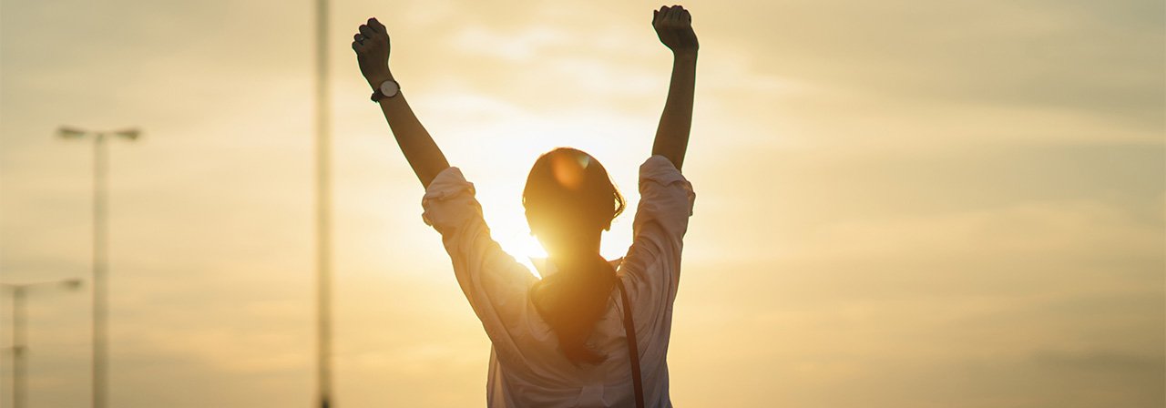 A woman looking at the sun