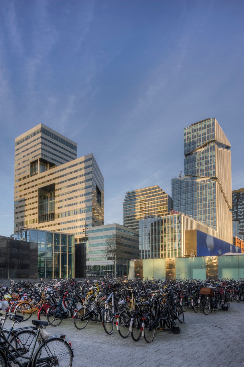 Bicycle parking lot and office buildings in Amsterdam's Zuidas district, Netherlands