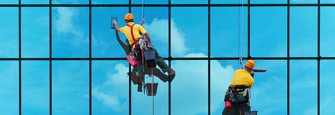 Two people cleaning the building