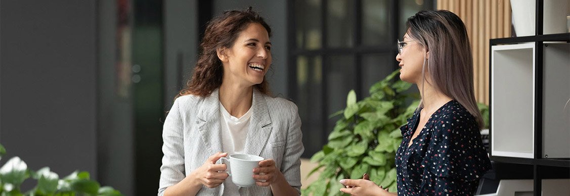 Two female employees talking