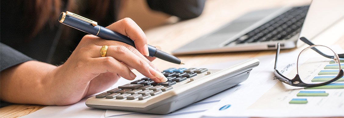 A women using calculator while working
