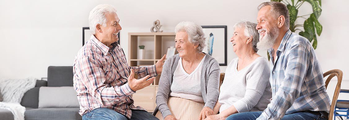 A group of older adults laughing happily