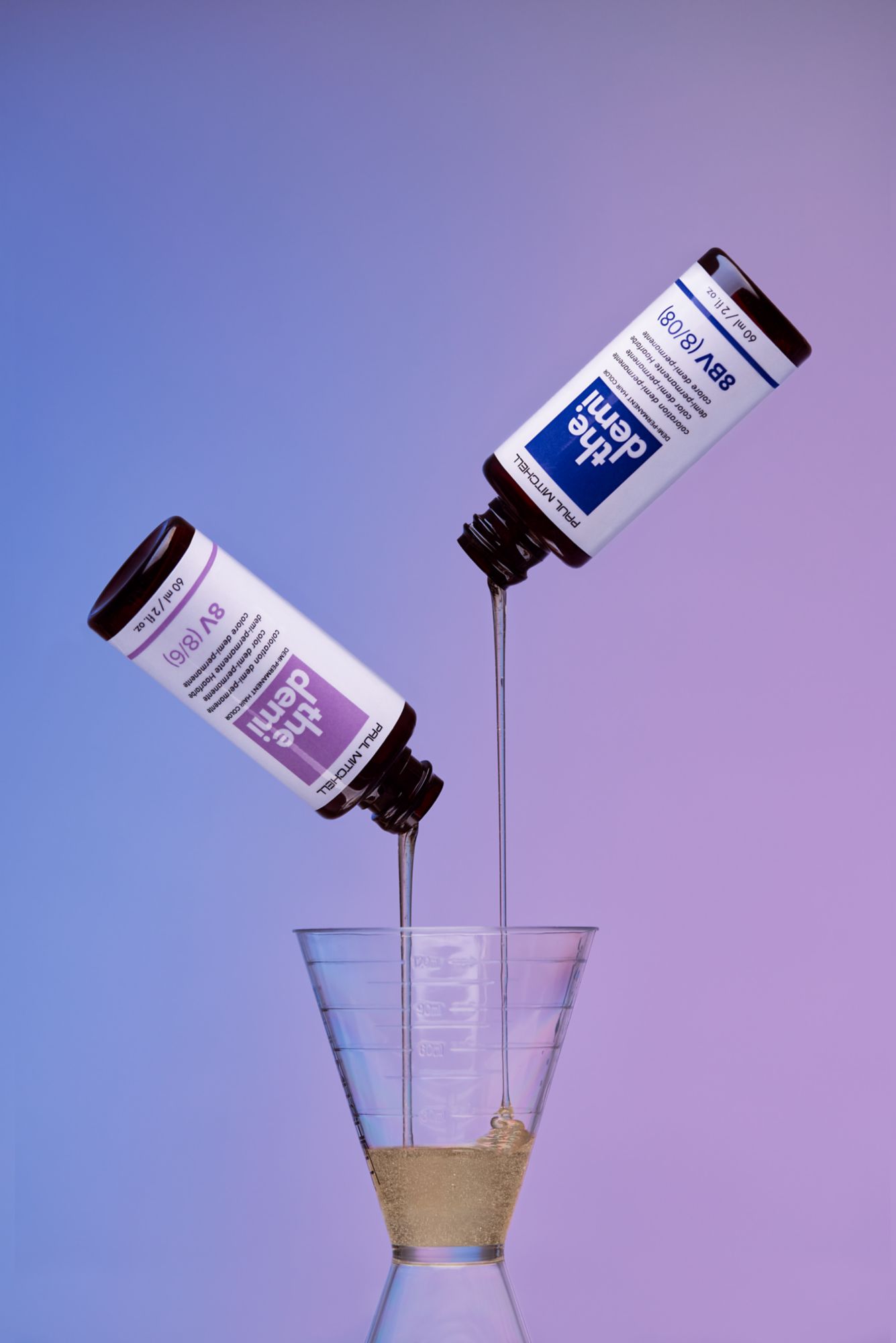 artistic image of The Demi 8BV and 8V poured into a measuring shot