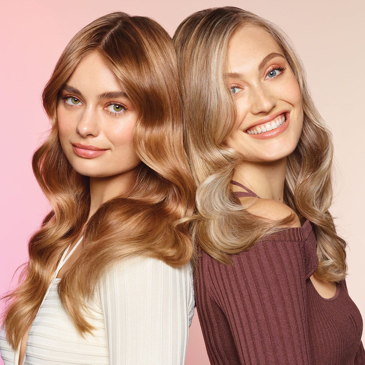 image of a two women with blonde hair standing back to back