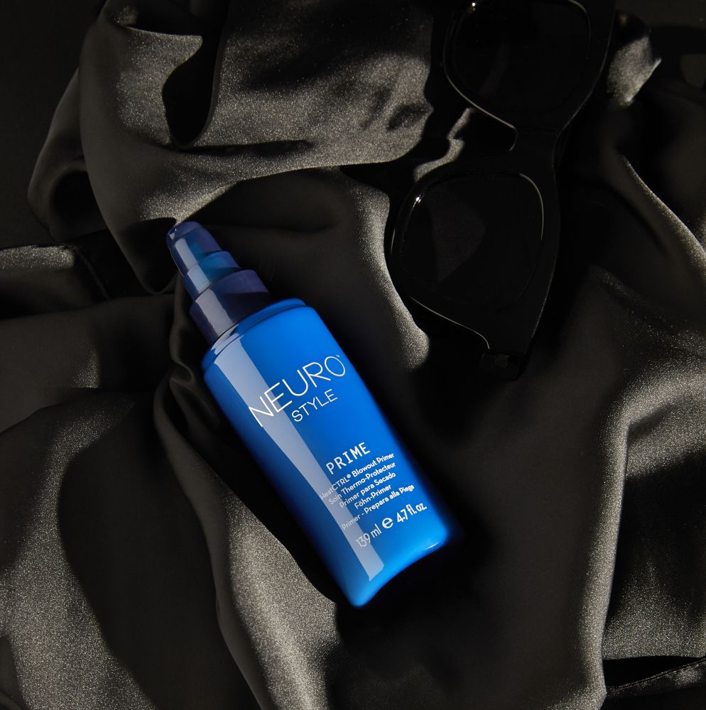 a bottle of Neuro Prime HeatCTRL Blowout primer