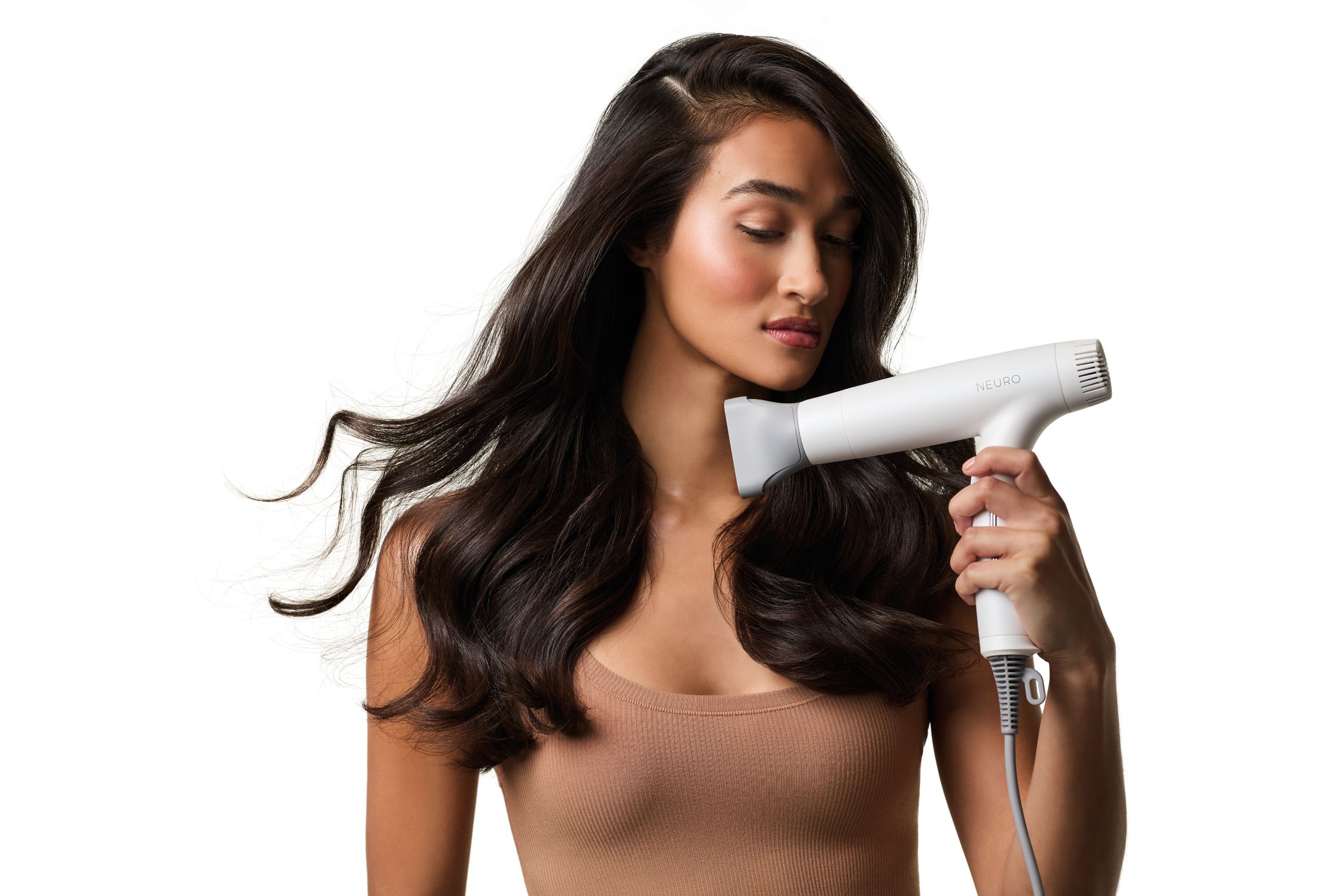 image of a woman drying her hair with the Neuro Dry+ Global Edition