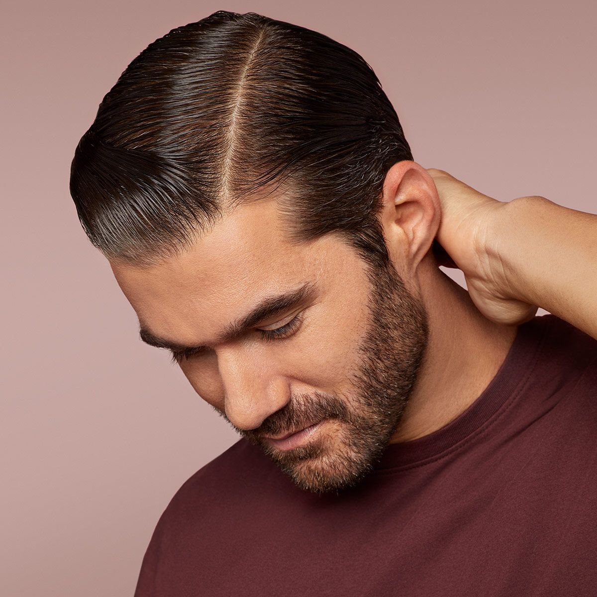 A man with brown hair slicked back