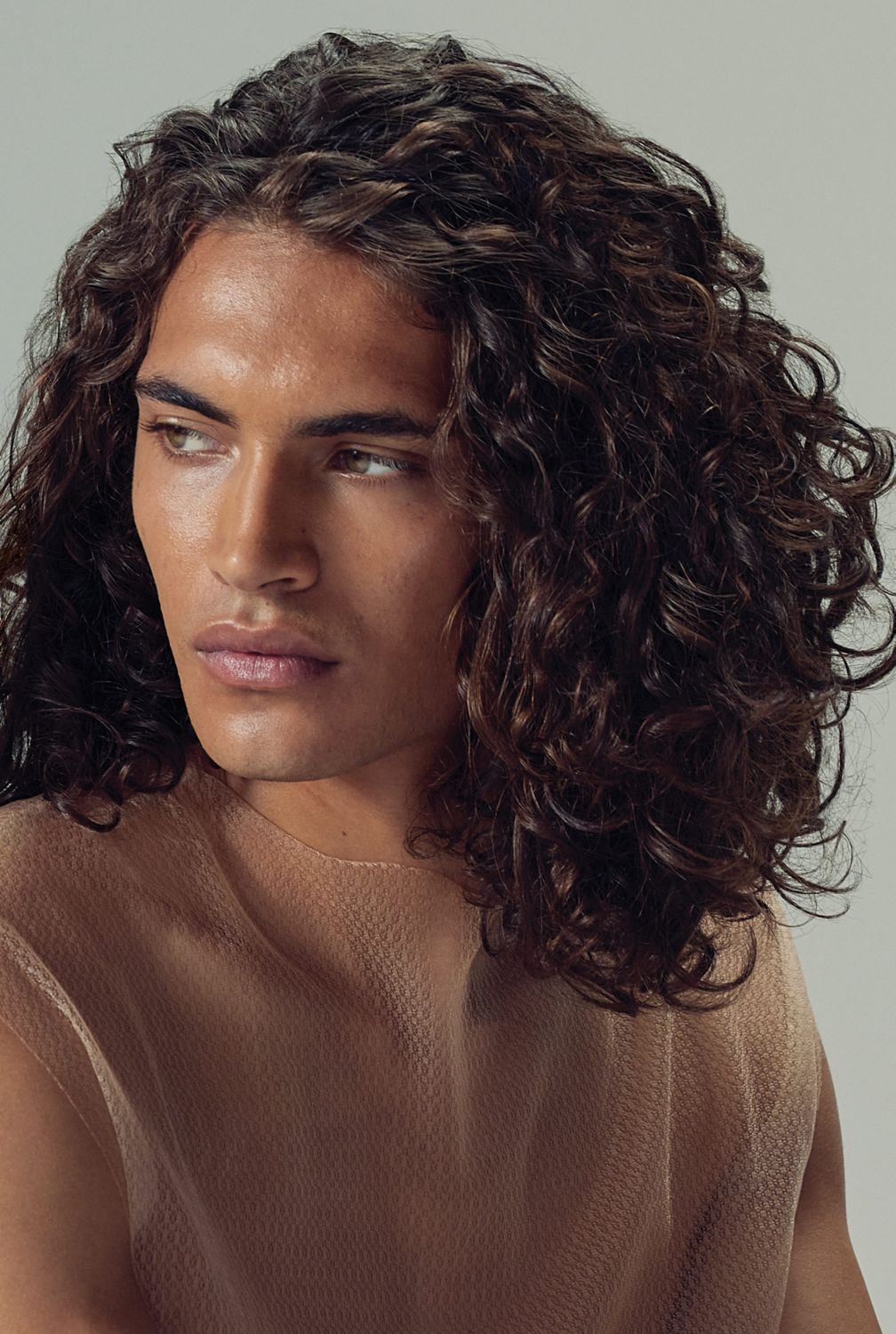 image of model with shoulder-length, wavy, brunette hair