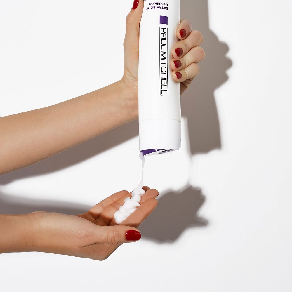 a bottle of Paul Mitchell Extra-Body Conditioner
