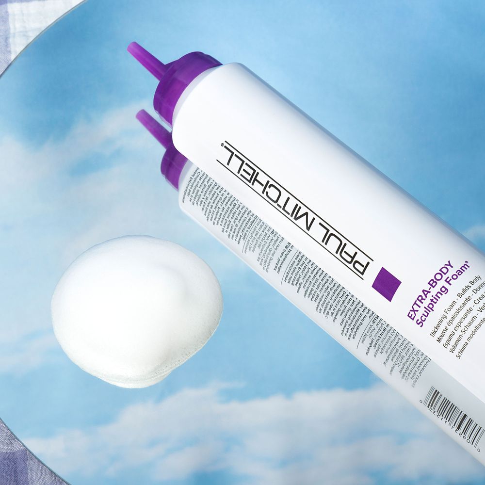 a bottle of Extra-Body Sculpting Foam