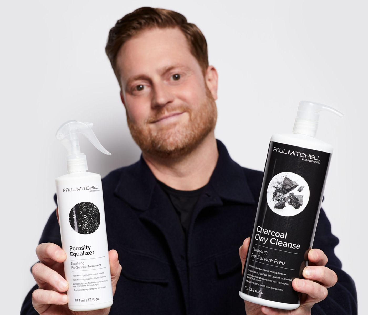 image of Colin Caruso holding Paul Mitchell Professional Pre-Service Prep products