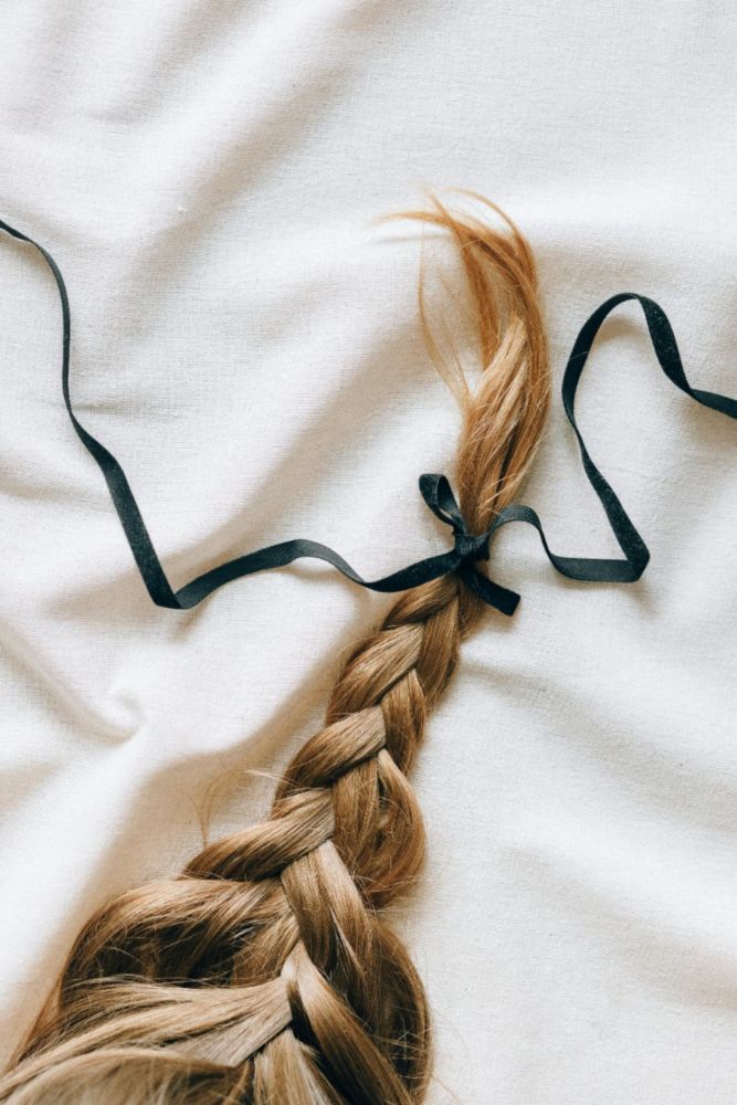 hair with a black ribbon
