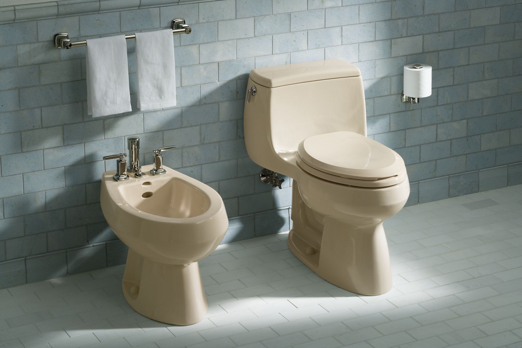 KOHLER bidet and toilet in tiled bathroom