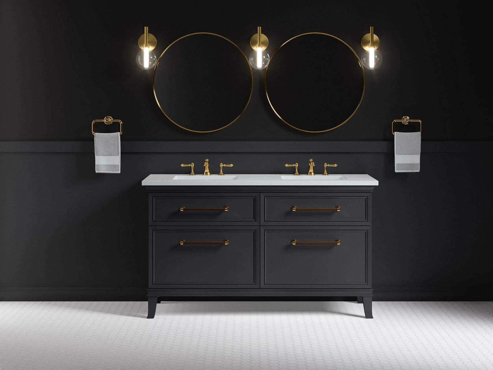 A dark, calming bathroom with white tile floors, navy blue double vanity with white top and brass widespread faucets against a navy blue wall, flanked by white towels on towel rings, with two round mirrors and three single sconces above it.