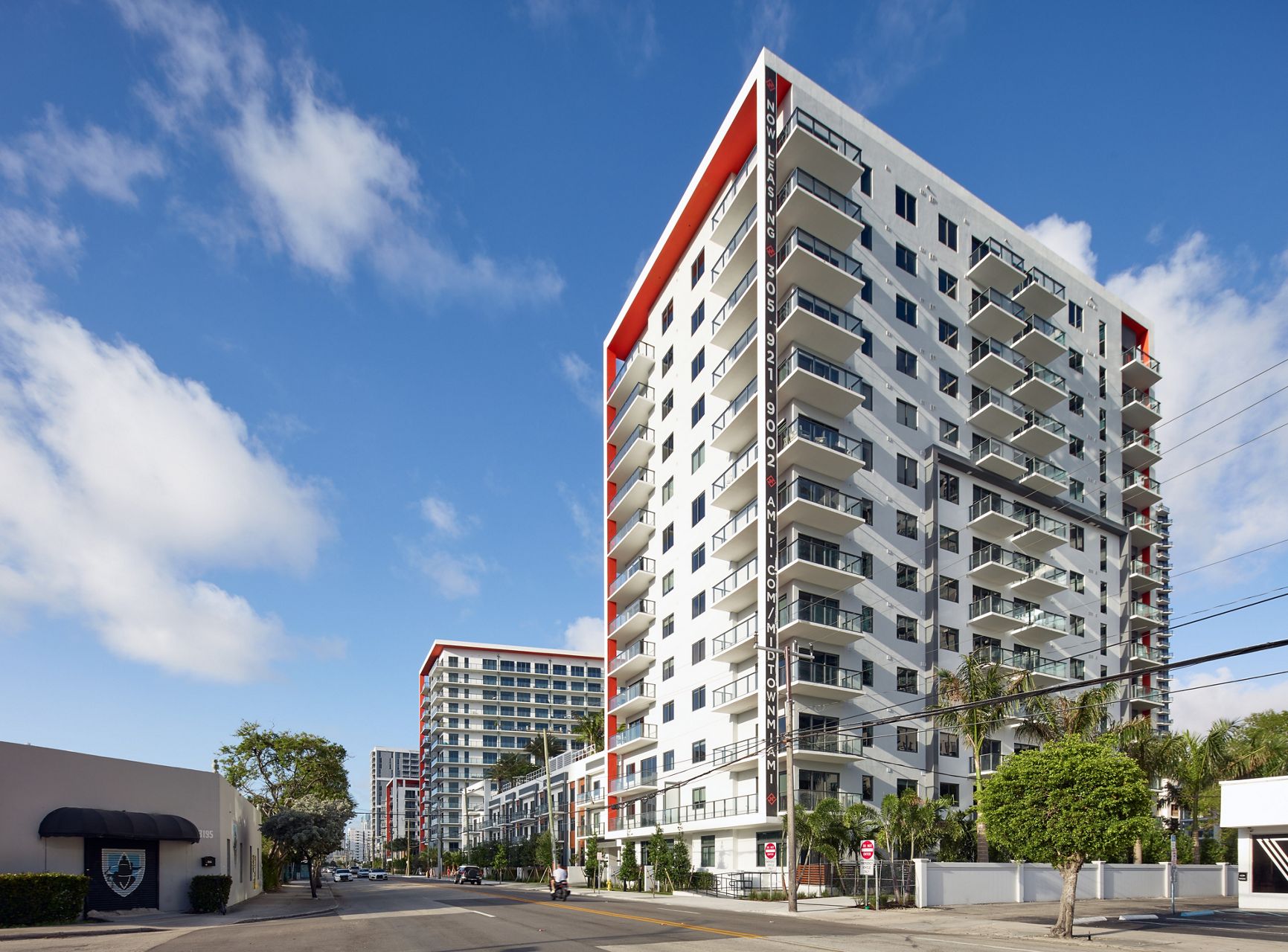 Photo of street view of the Midtown Miami building in daylight.