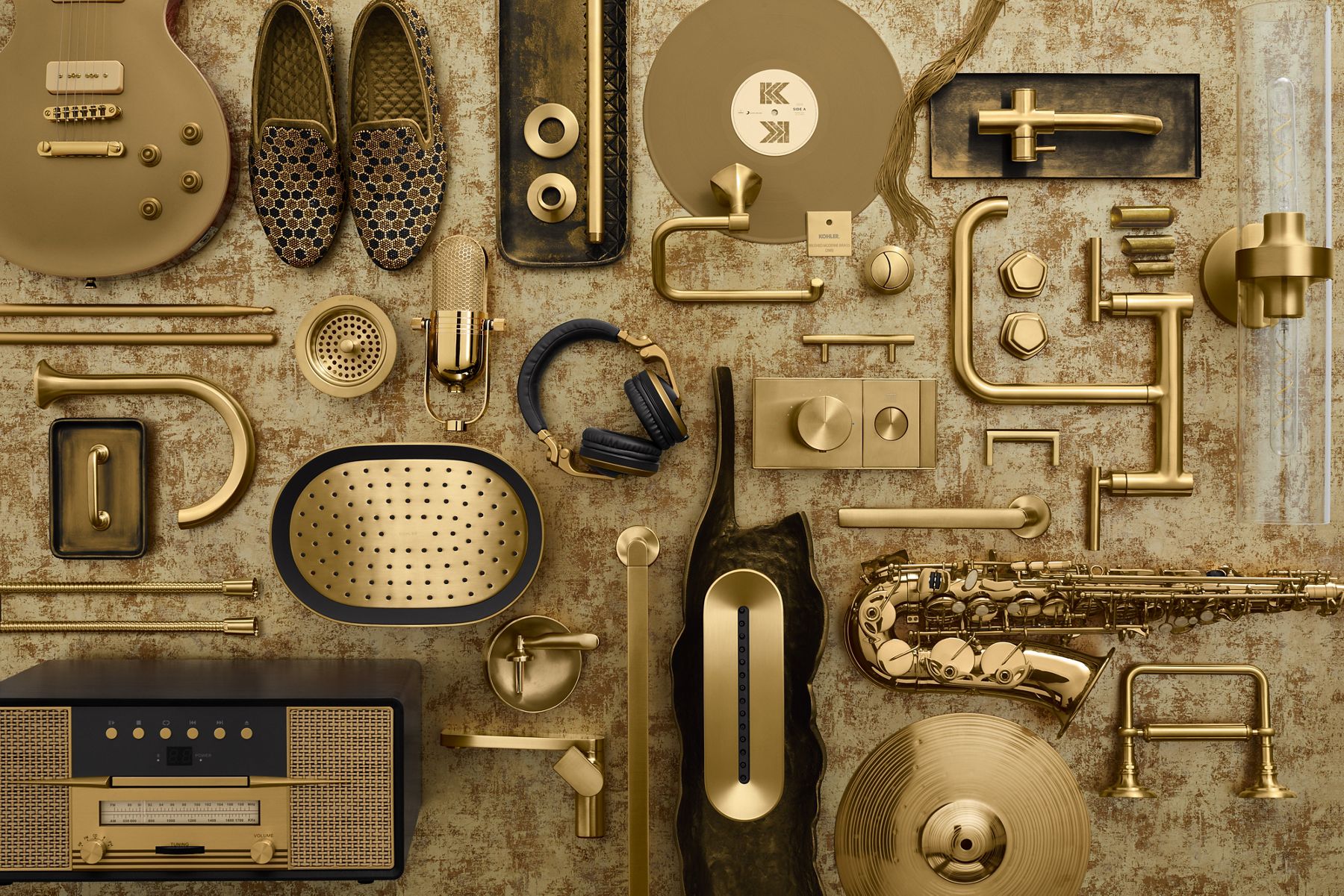 KOHLER product sampling of matching brass finishes across faucets and other brass notables like saxophones.