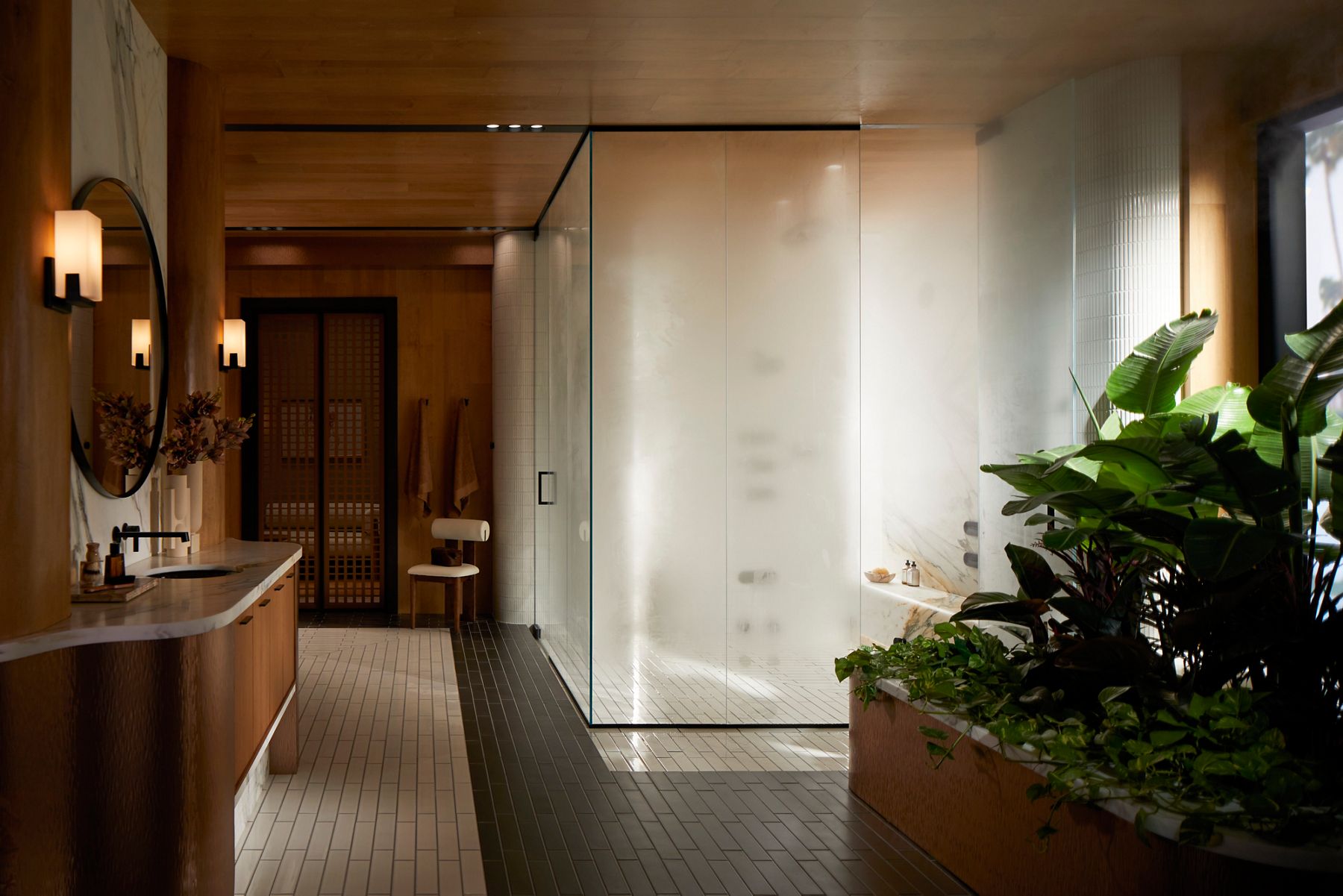 Modern glass-enclosed steam shower room with wooden ceiling and bench seating.