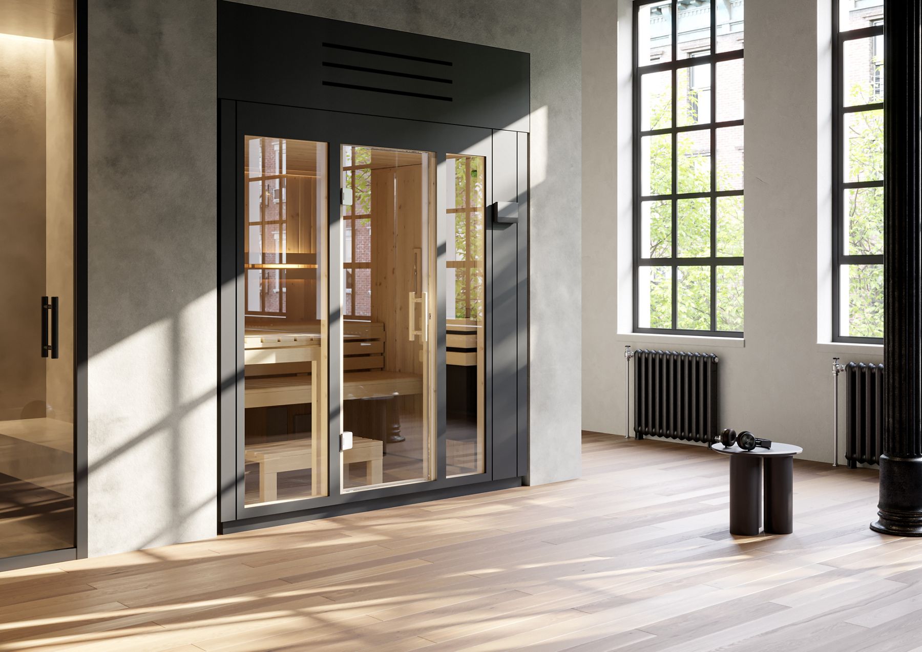 Minimalist home wellness corner with a dark-framed glass sauna and natural wood floors near tall windows.