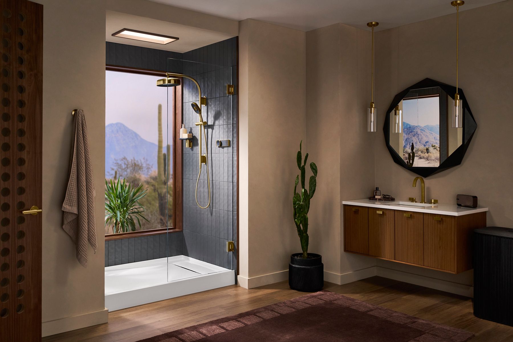 Evocycle shower system with a round rainhead and handheld spray, presented in a sleek walk-in shower with large-format tile.