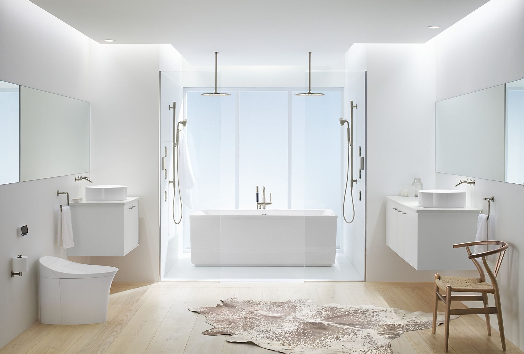 A contemporary white bathroom featuring wall hung vanities, vessel sinks, and a wet room with freestanding tub and shower with wall mount and rainhead showerheads