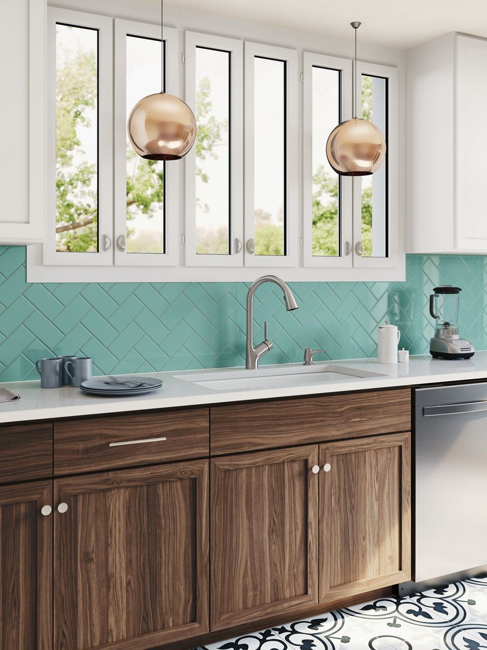 Daylight in transitional kitchen with turquoise tile backsplash and pendant lights hung in front of a large window featuring Setra voice controlled kitchen faucet installed in white countertop with undermount sink. 