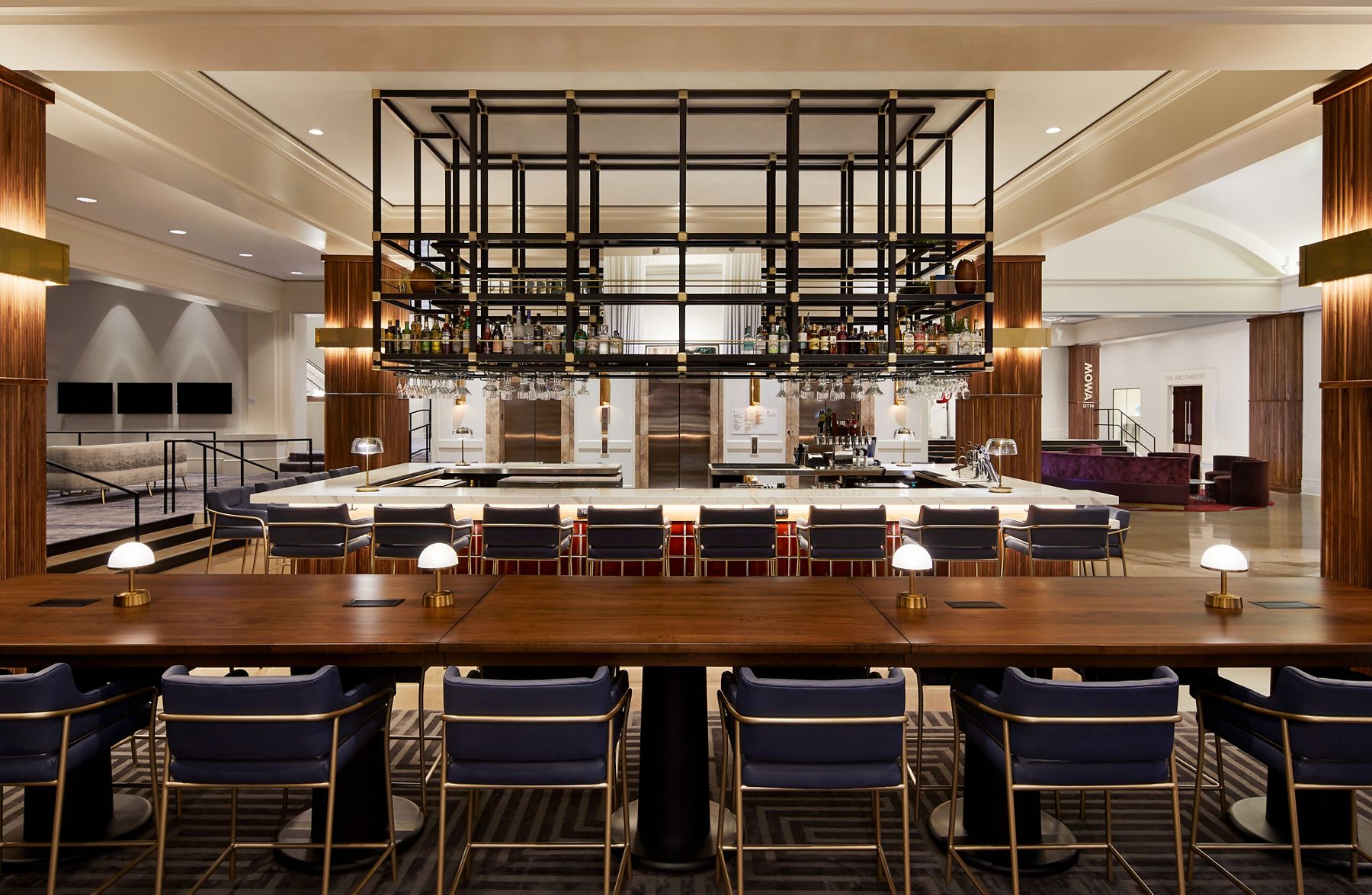 Image of the Bar at Saint Kate hotel featuring a large range of seating and Kohler products with original tiles from Ann Sacks.