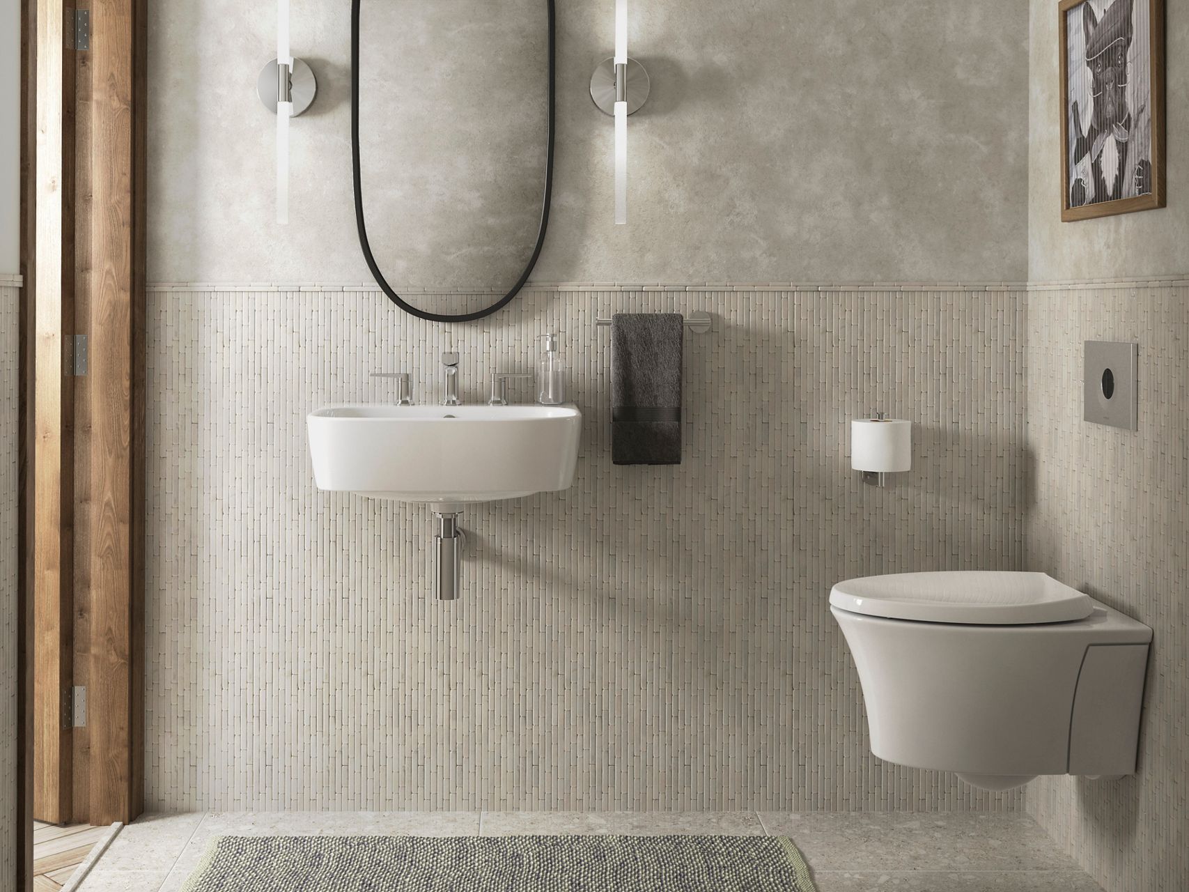 A white wall-mount sink on a fluted stone wall with chrome faucet and hardware.