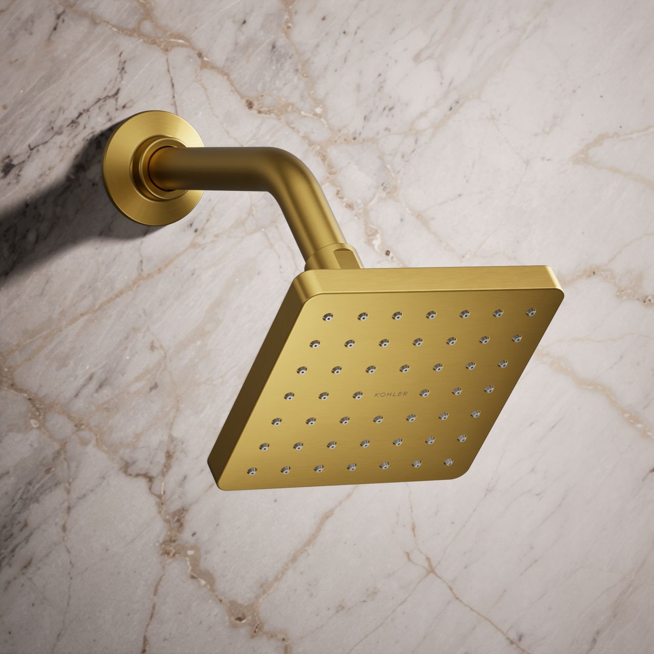 Gold-toned Parallel® showerhead in a marble shower.