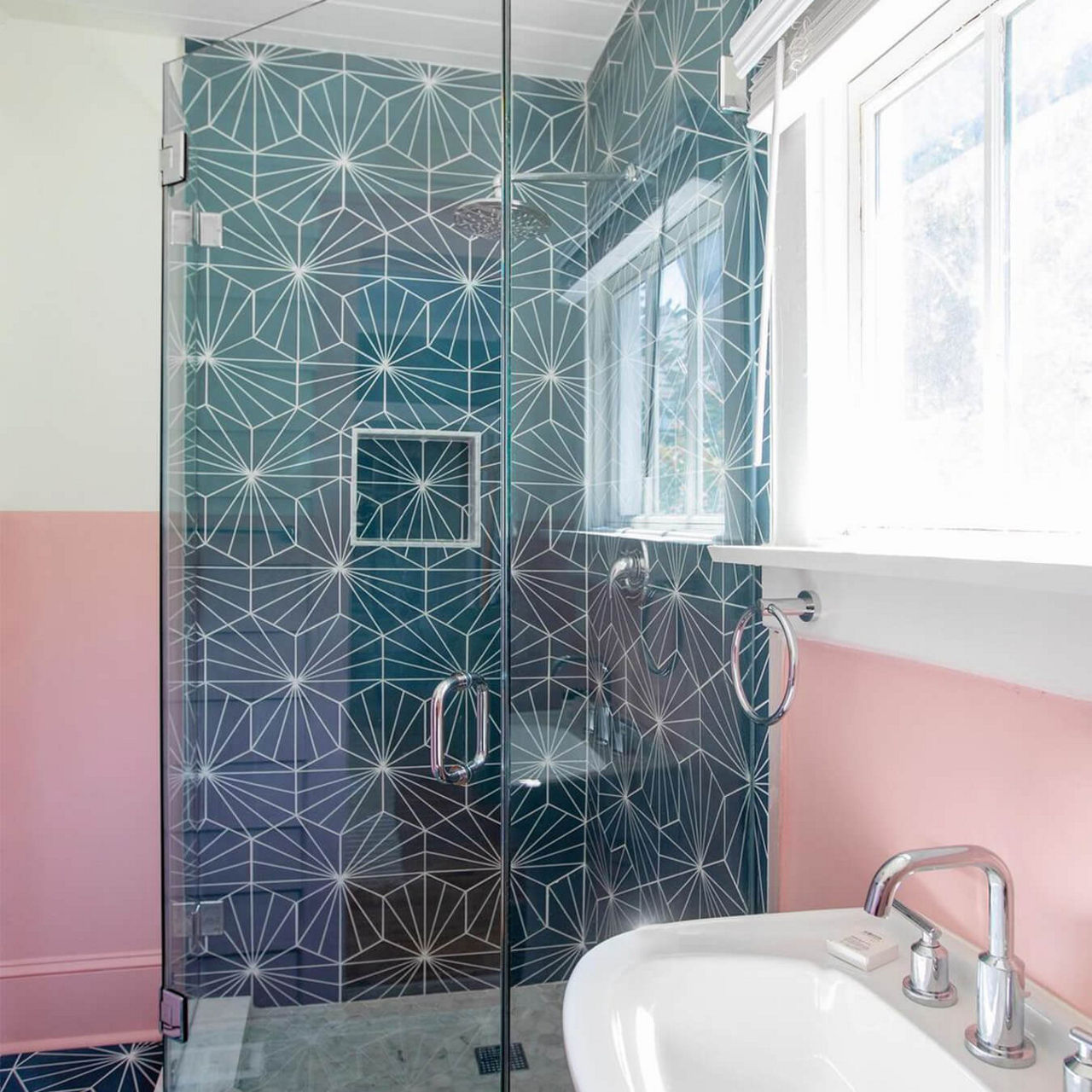 A before picture of  @demiliodesign's bathroom with a pentagon shower enclosure.