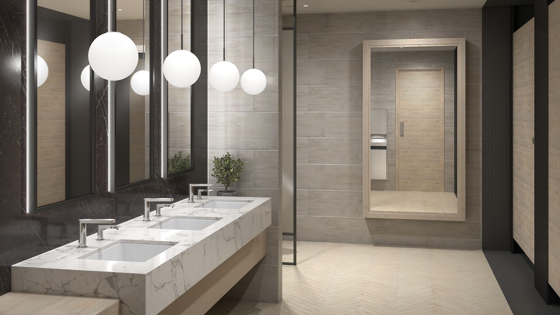 A contemporary faucet with a similarly designed soap dispenser to its right on a stone counter top with a white undermount sink.
