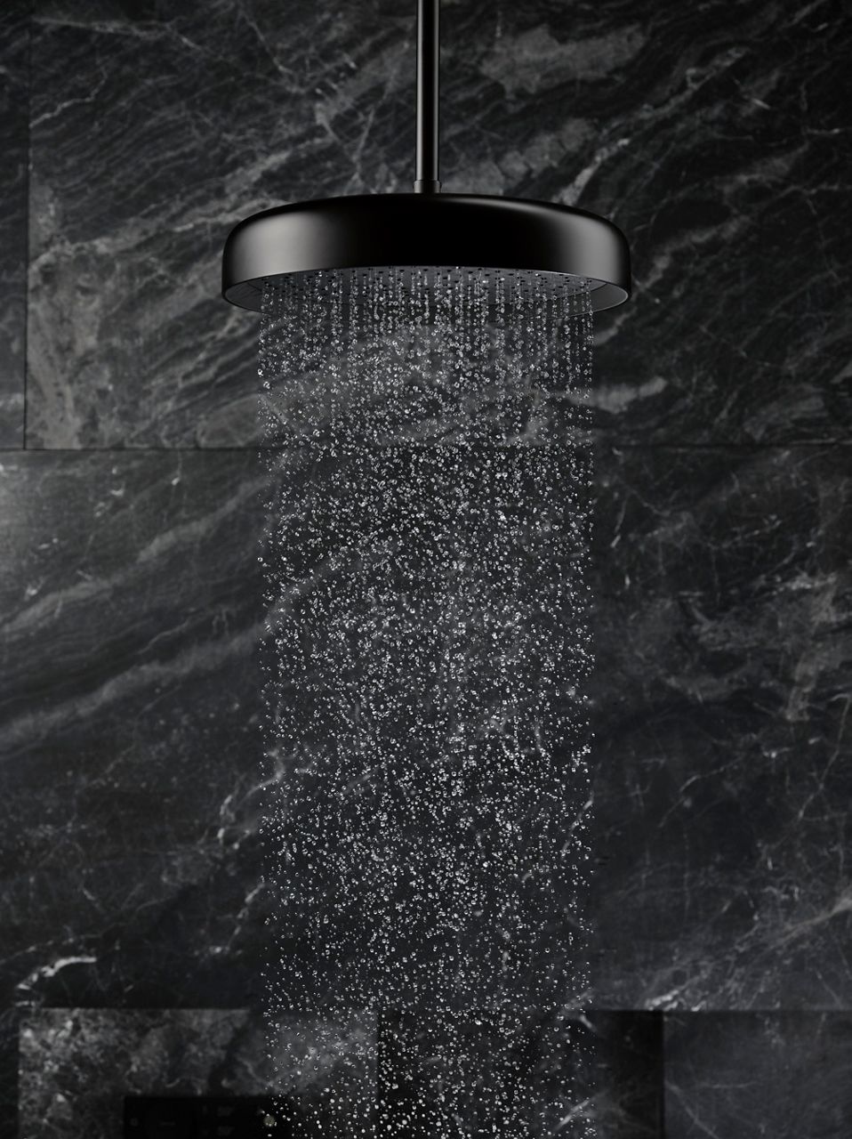 Close-up detail of a rainhead with water coming out of it.
