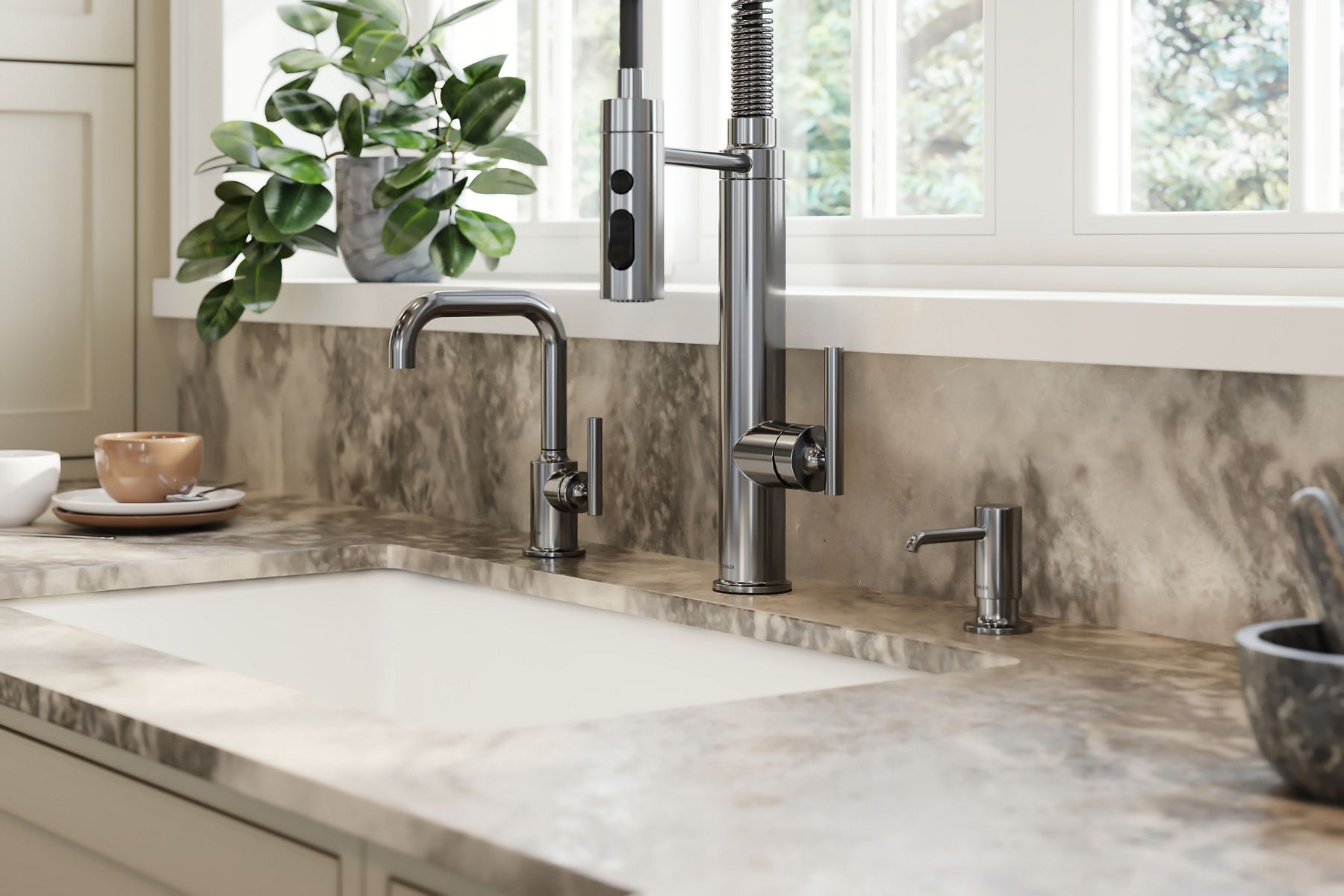A close up shot of a shiny silver sink faucet with a single lever.