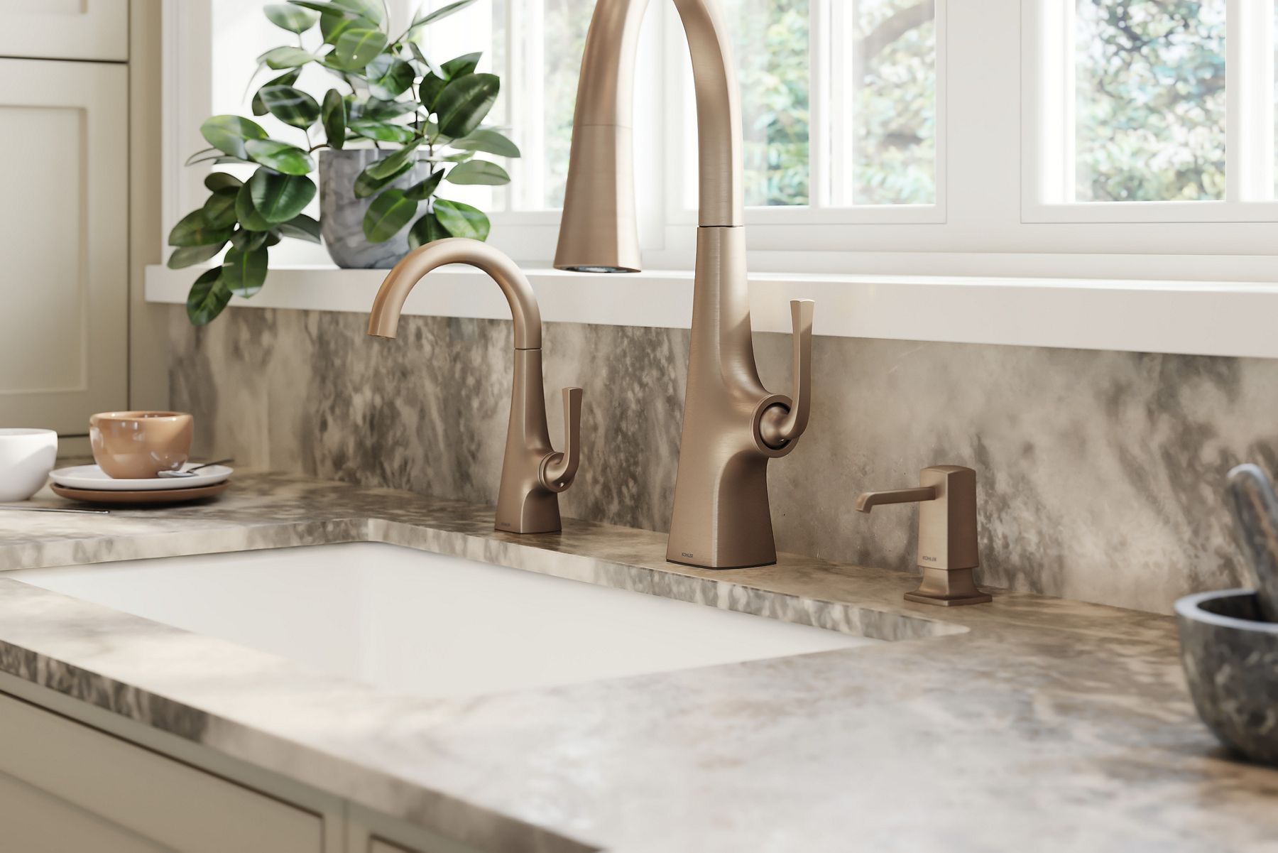A close up image of a brushed bronze gold sink faucet with a single lever.