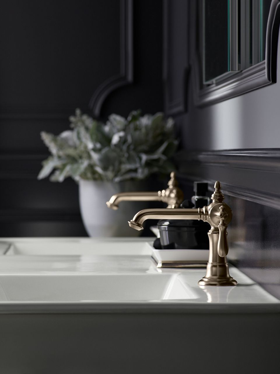 Side view of a faucet in brushed bronze.