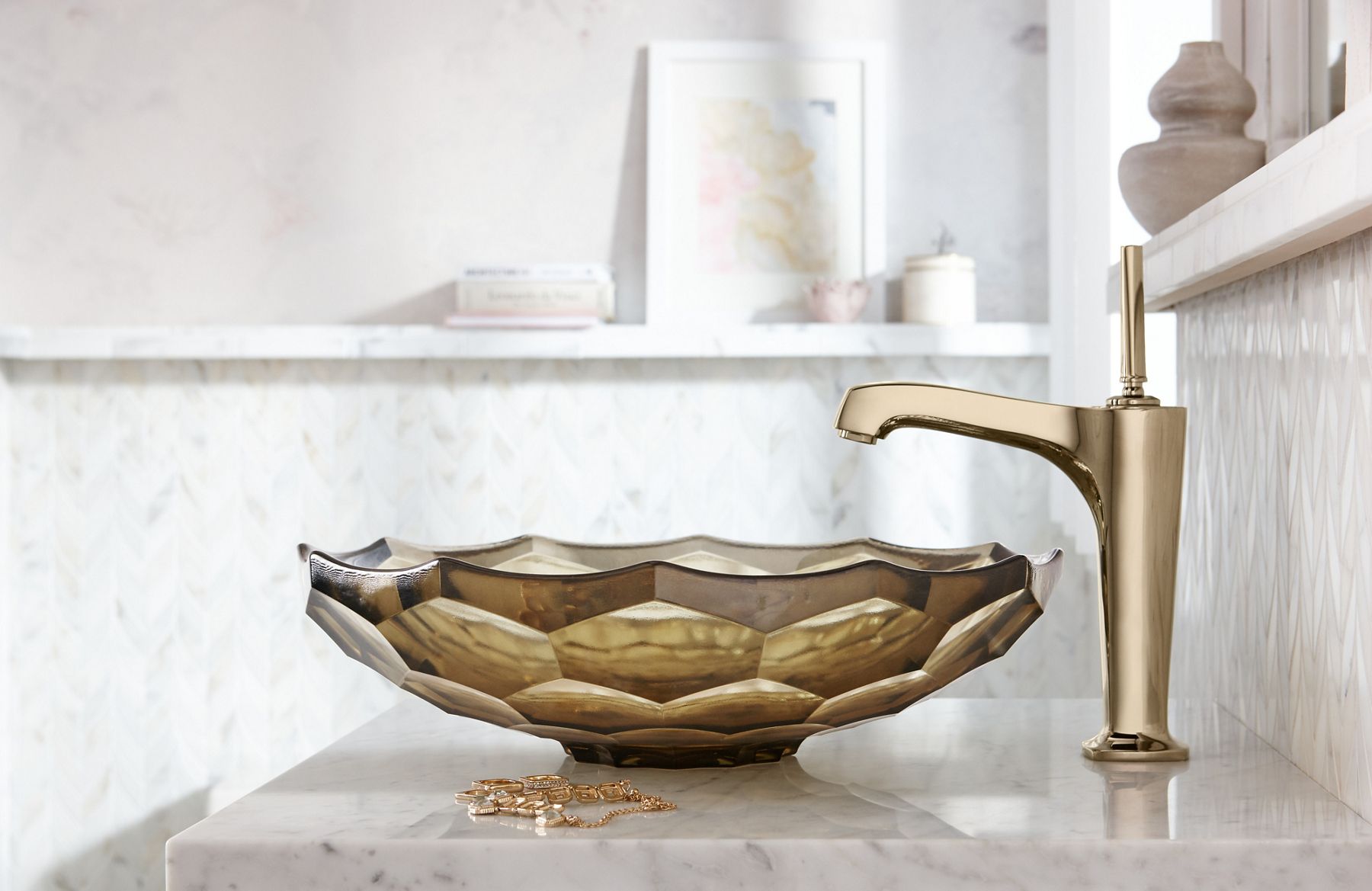 Side view of a faucet in French gold.