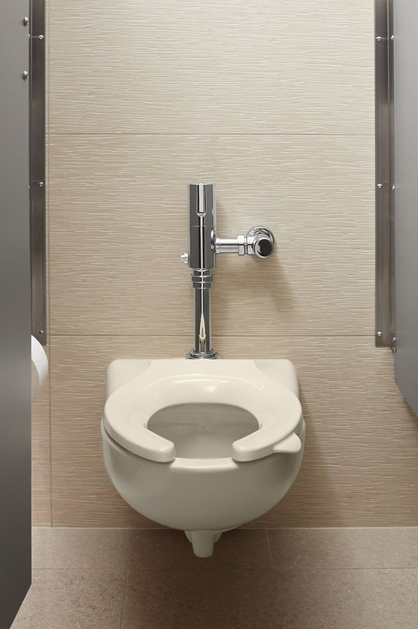 A wall-mount toilet with a toilet seat with a handle on the right side.