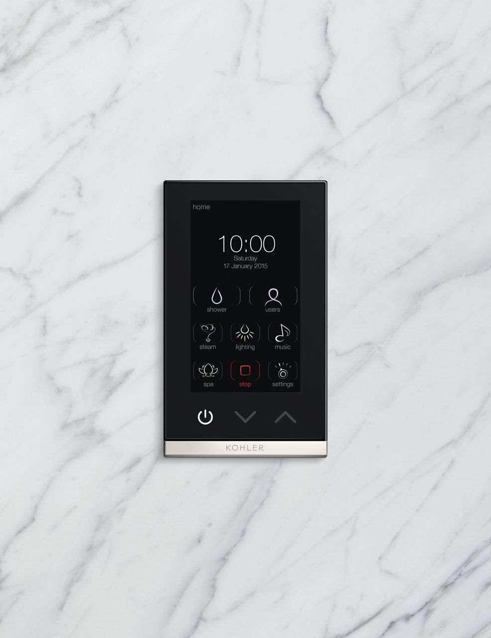 A close-up portrait shot of a digital control pad against a marble background. The screen displays the time and illustrated shower functions.