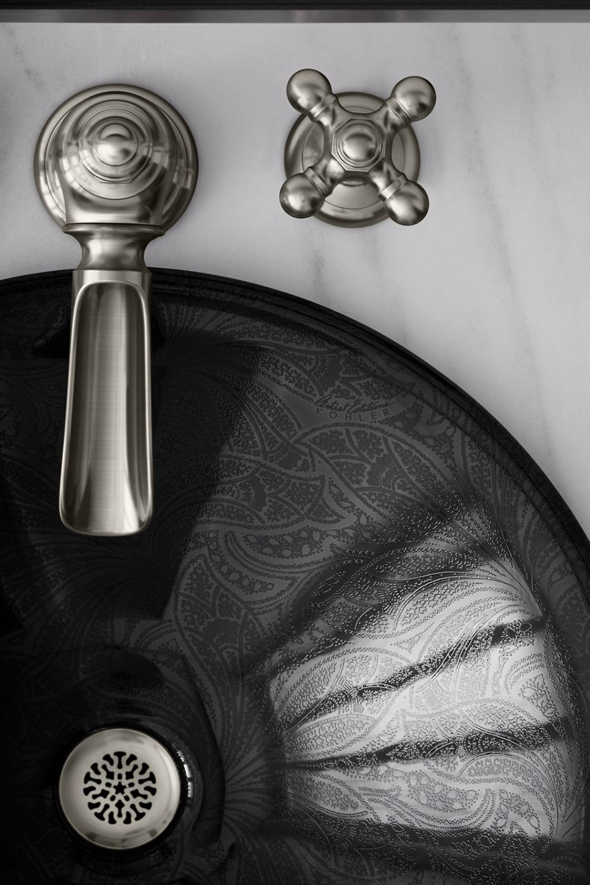 Overhead view of a faucet in brushed nickel.