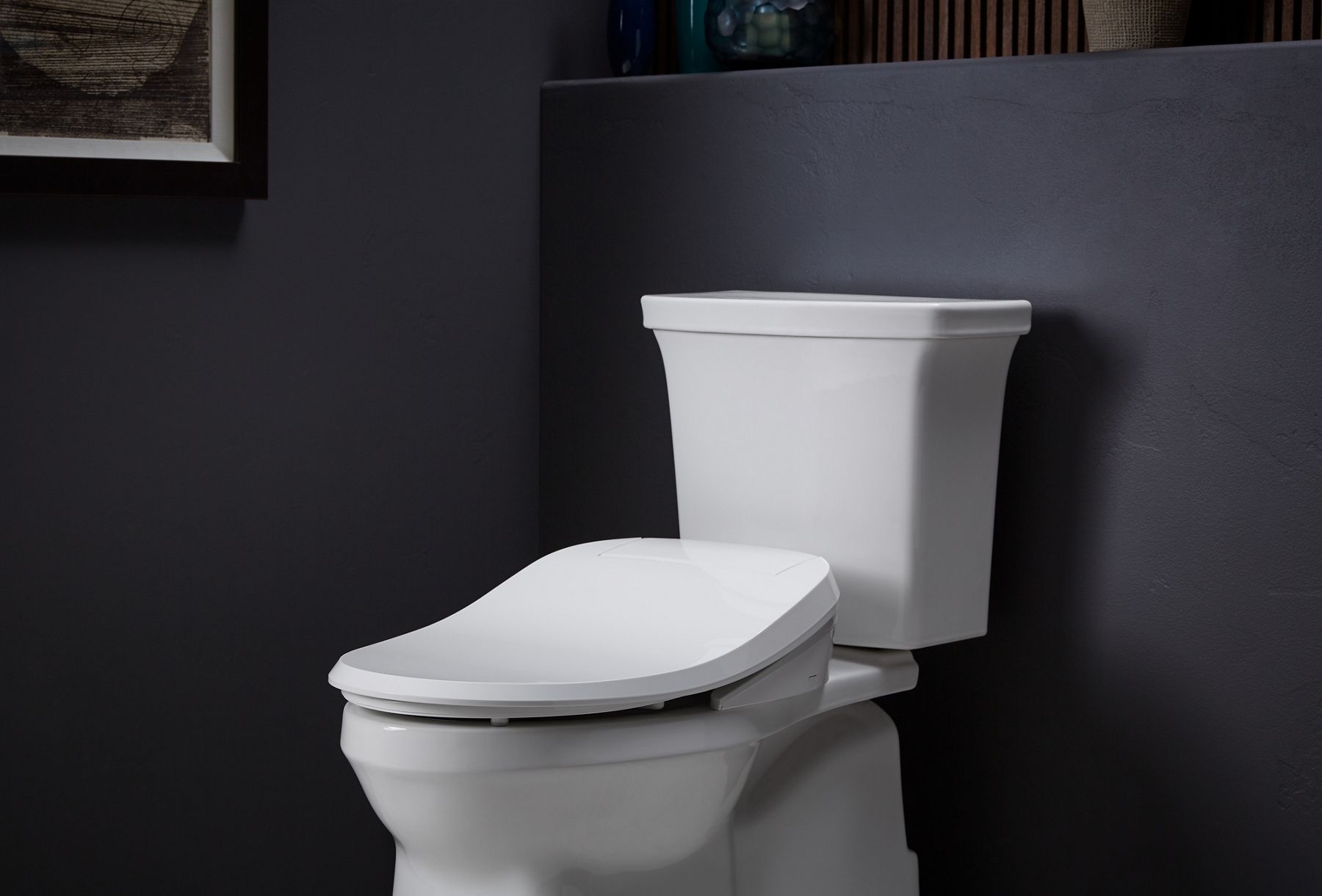 Angled view of a C3-420 bidet seat on a toilet.