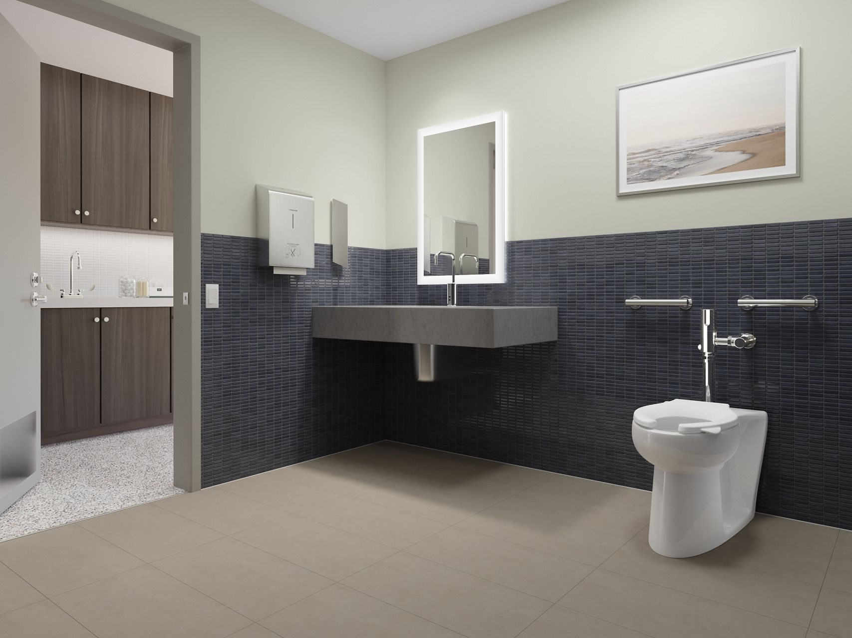 A floor-mount public toilet on a brown floor with a dark blue tile wall.